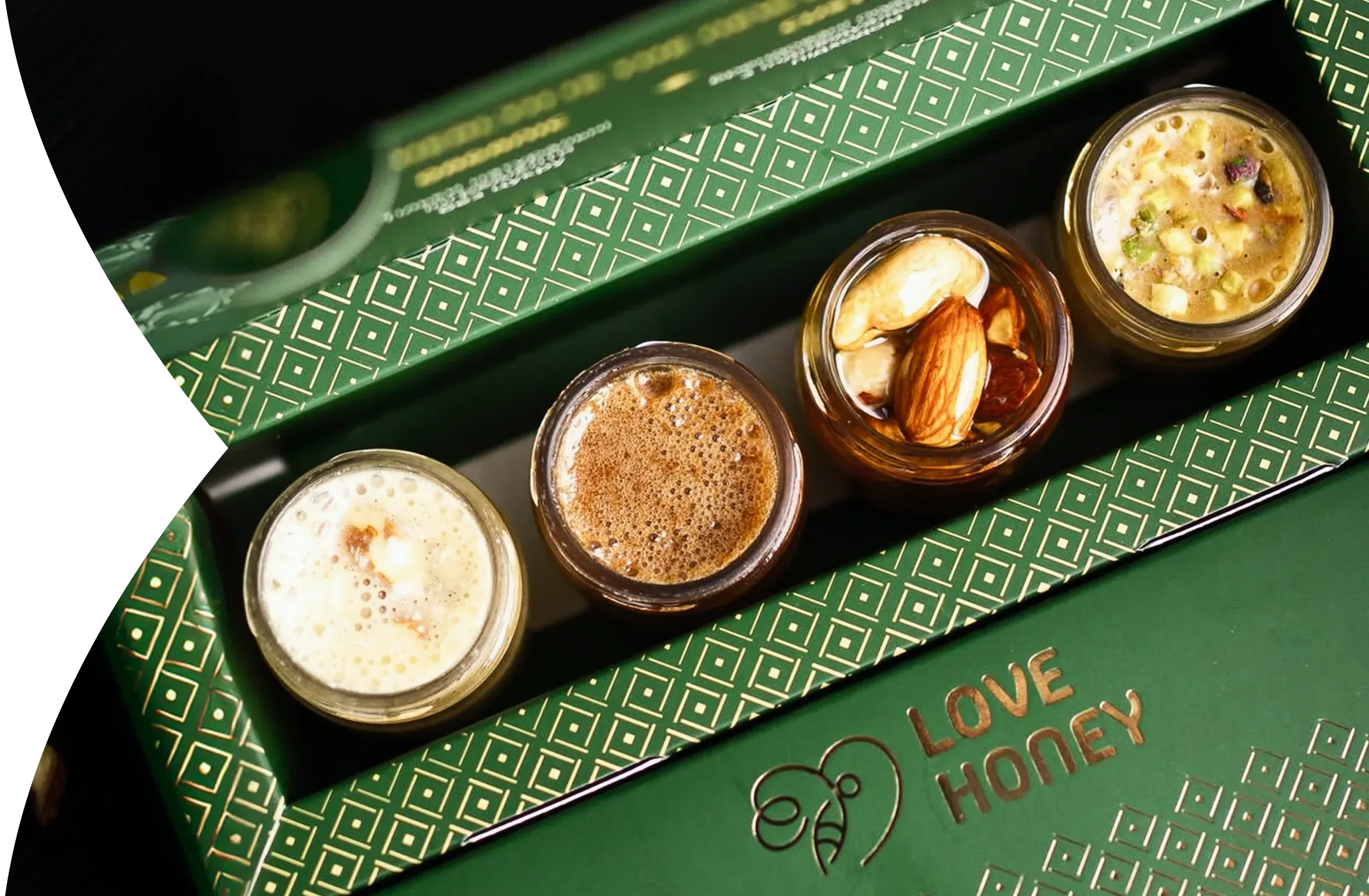 Дегустаційний набір LOVE HONEY: чотири банки медових паст у зеленій коробці